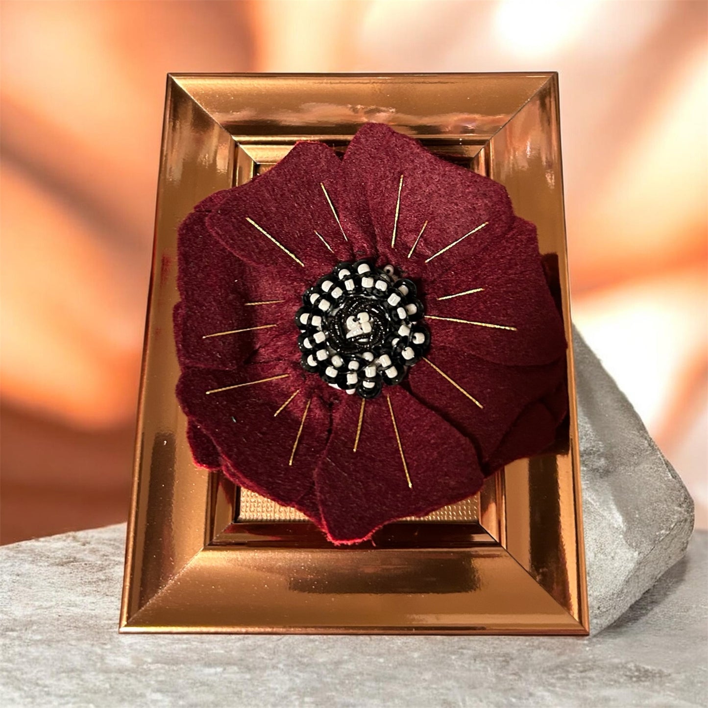 Burgundy felted flower