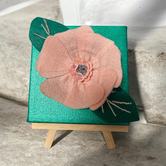 Green flower mounted on square canvas