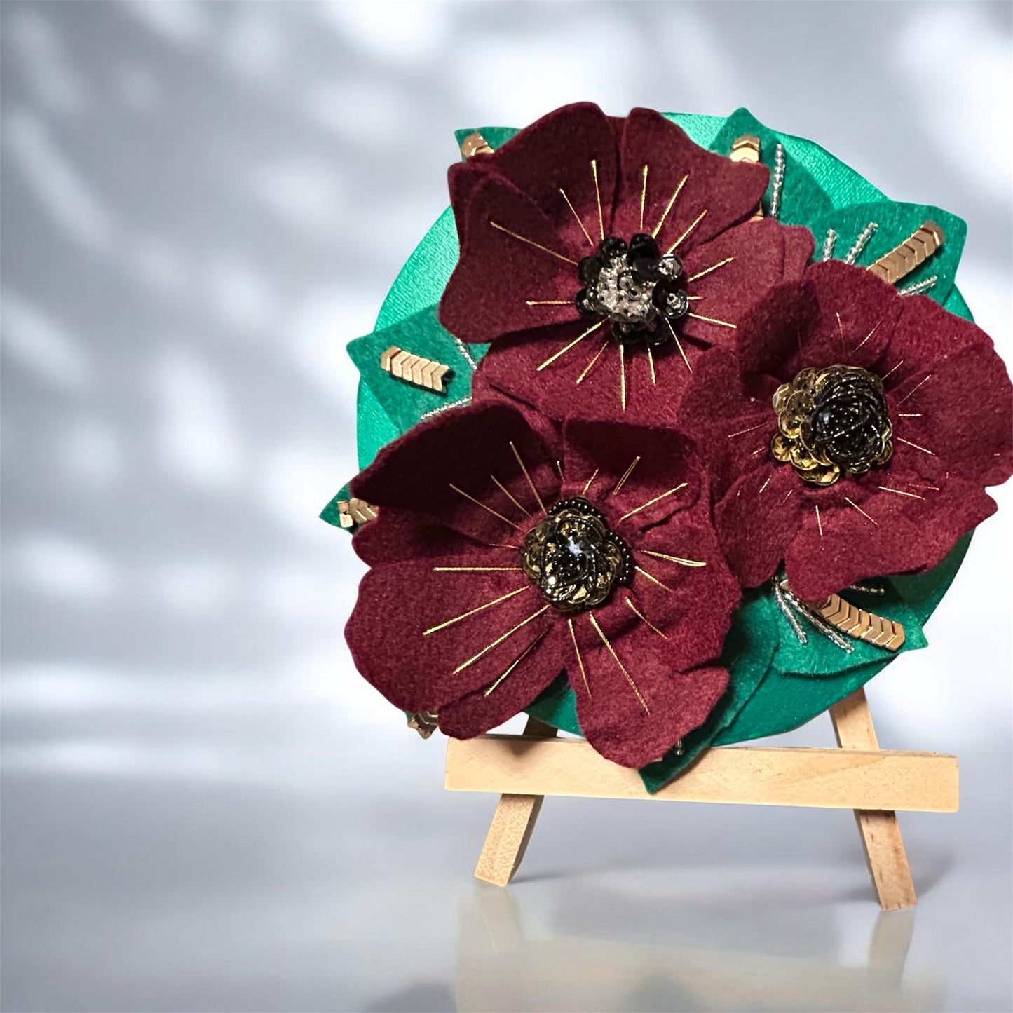 3 burgundy flowers on canvas
