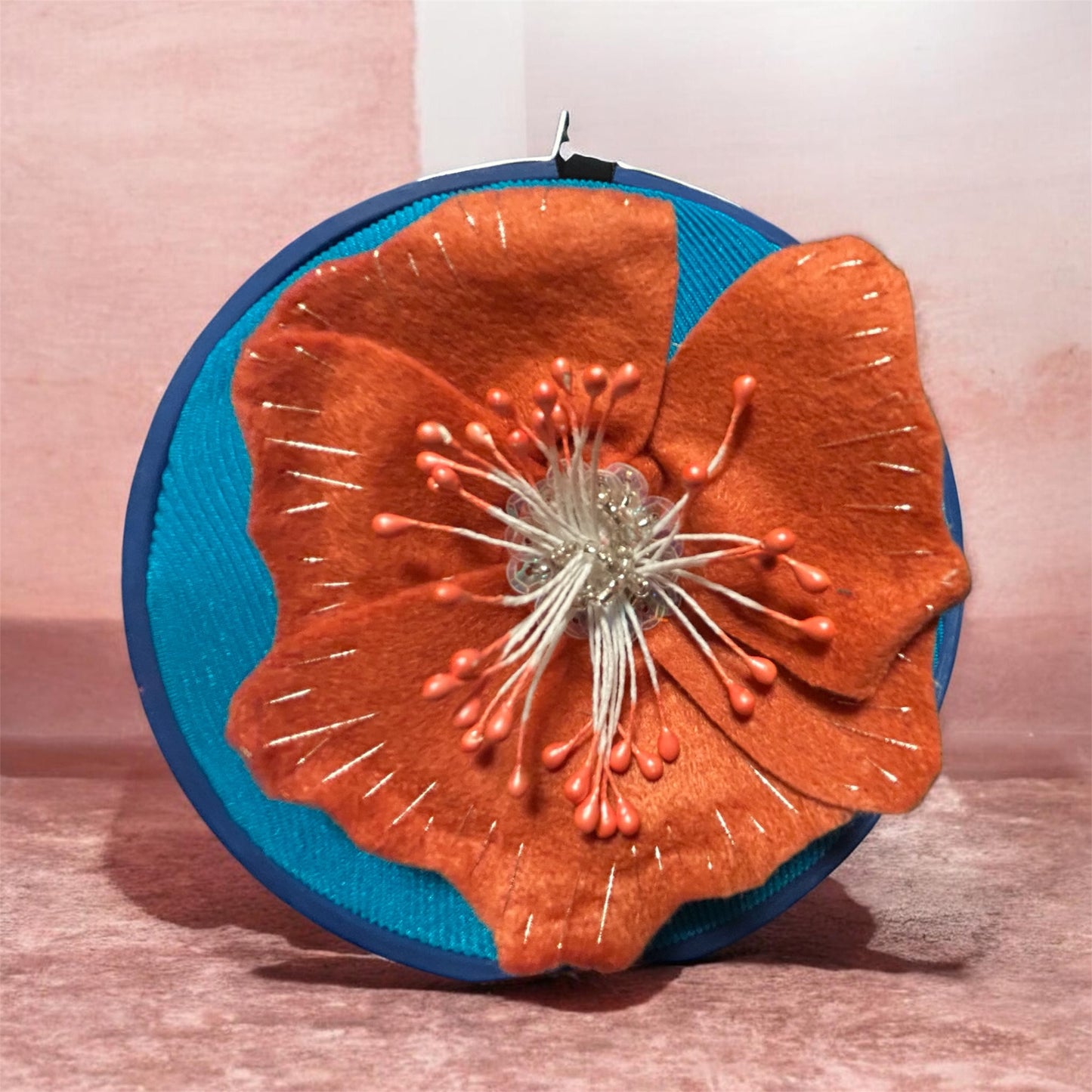 Orange flower stretched blue canvas